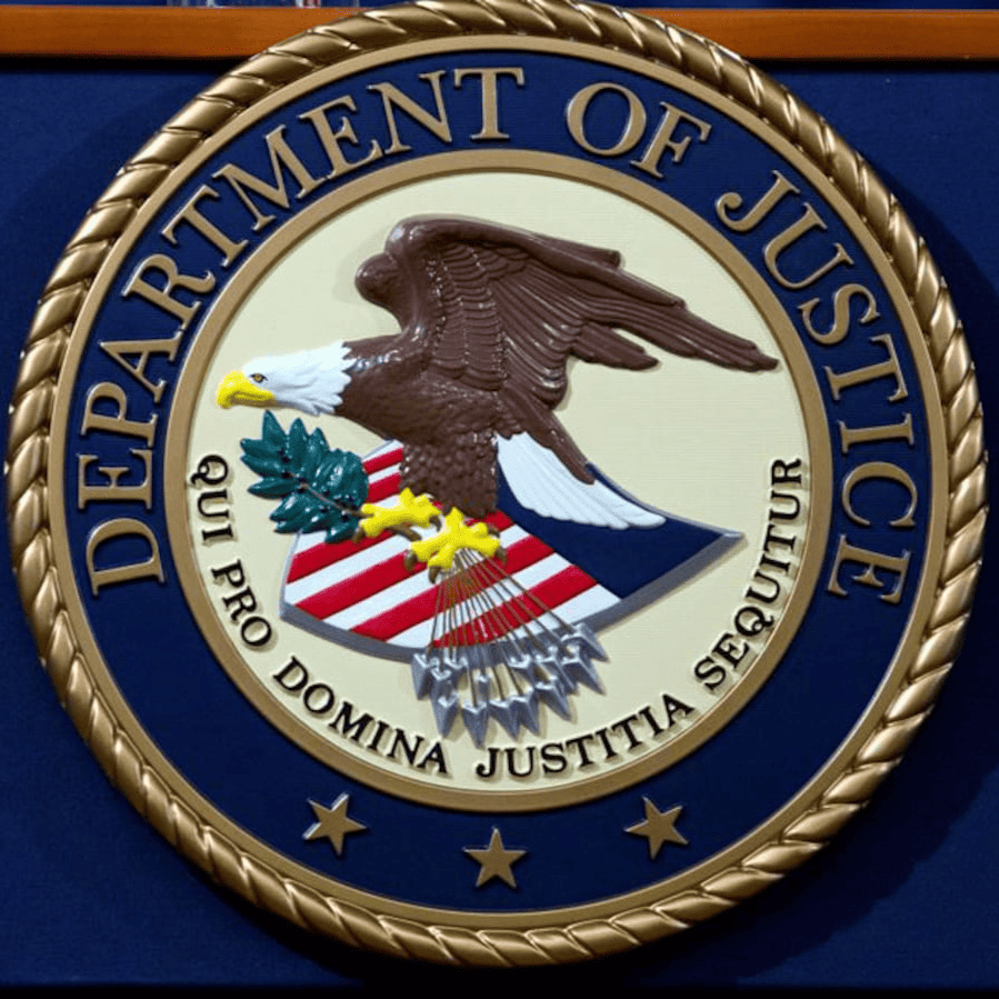 The DOJ logo is displayed on a blue background.