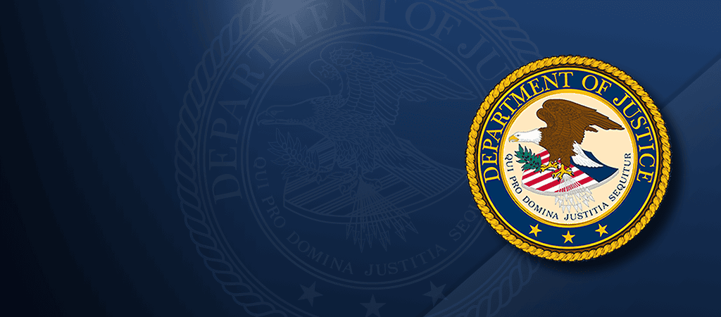 The official seal of the U.S. Department of Justice displayed on a dark blue background, highlighting their efforts to Take Down Lockbit.
