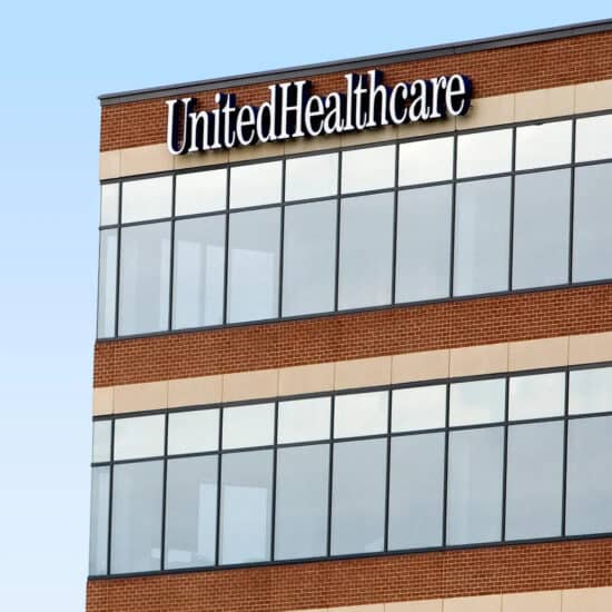 Exterior of a modern building showing the "UnitedHealthcare" and "Change Healthcare" logos on the facade.