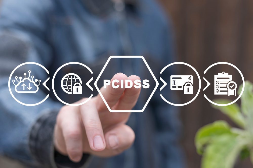 A person touches a transparent screen showcasing "PCI DSS," encircled by icons of data security and technology.