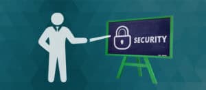 A stick figure points at a chalkboard on an easel displaying a padlock icon and the word "SECURITY," illustrating the importance of cybersecurity for small business.