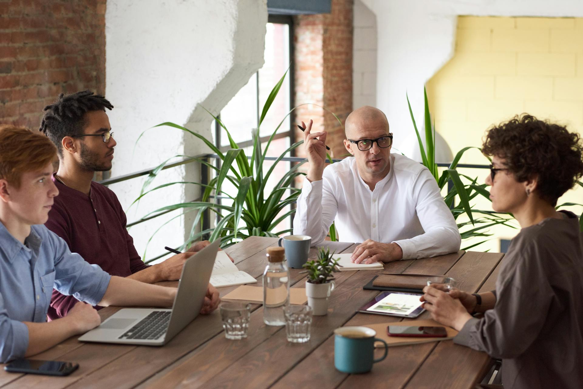 IT support team at workstations in a professional office