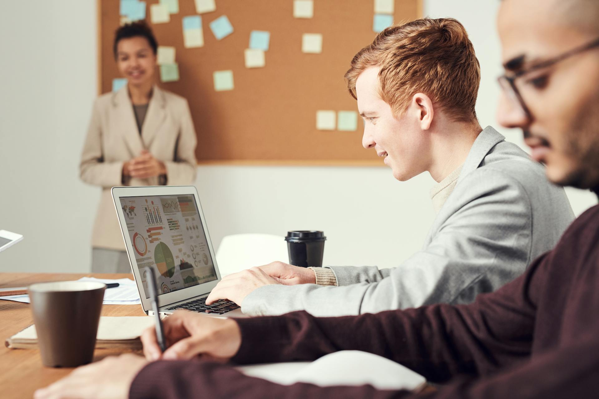 IT support team at workstations in a professional office