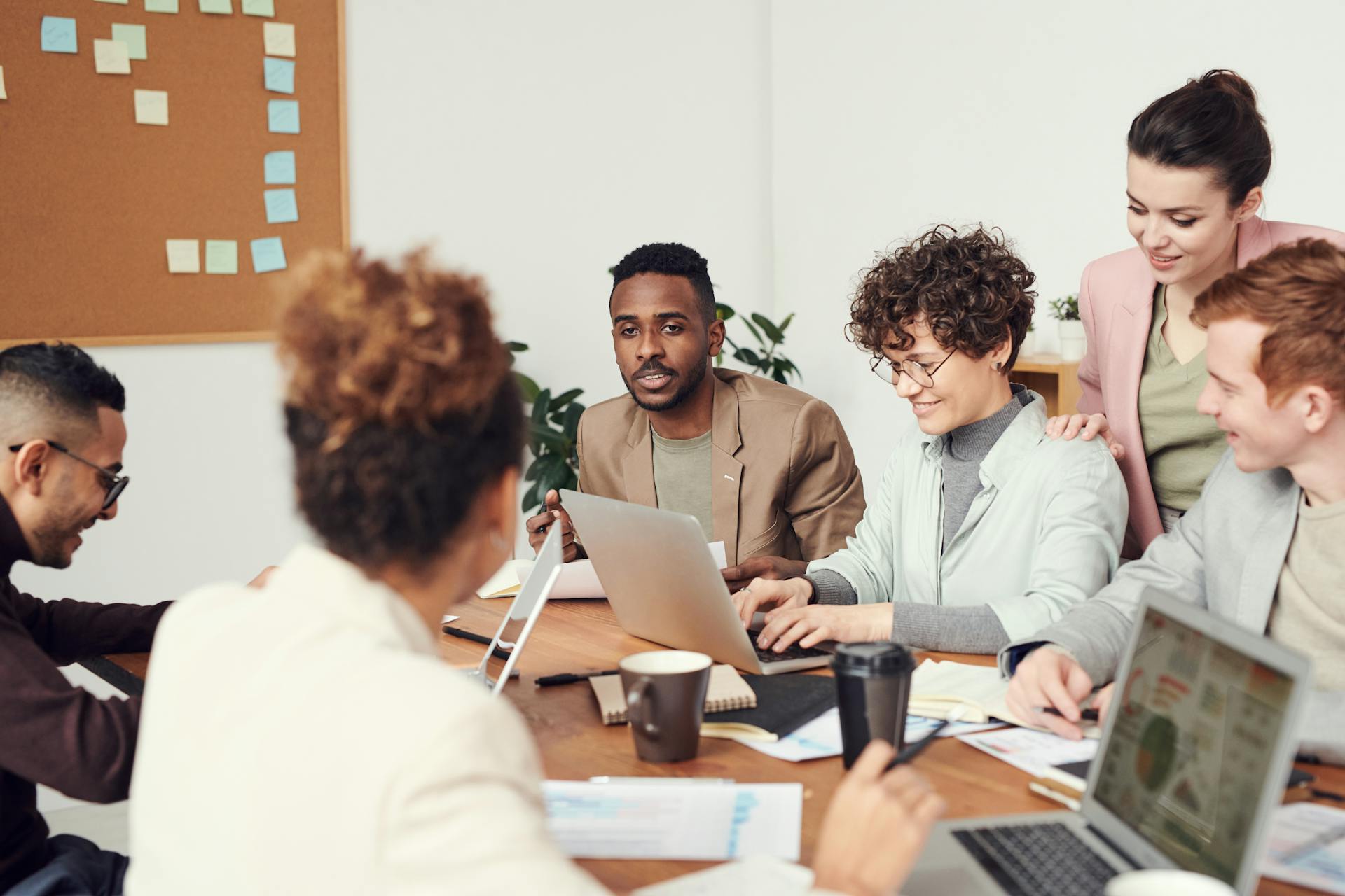IT support team at workstations in a professional office