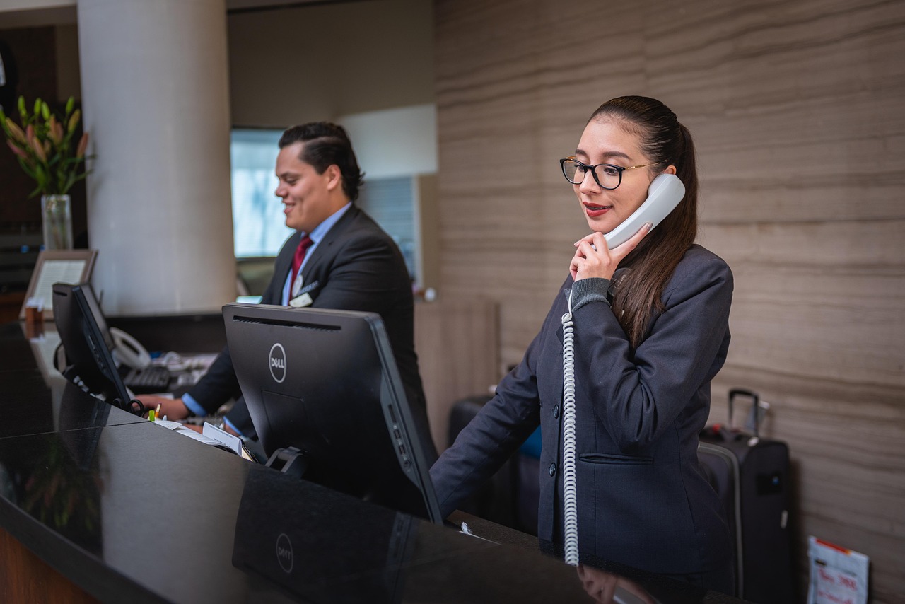 IT helpdesk technician wearing headset providing remote managed IT support to local business client
