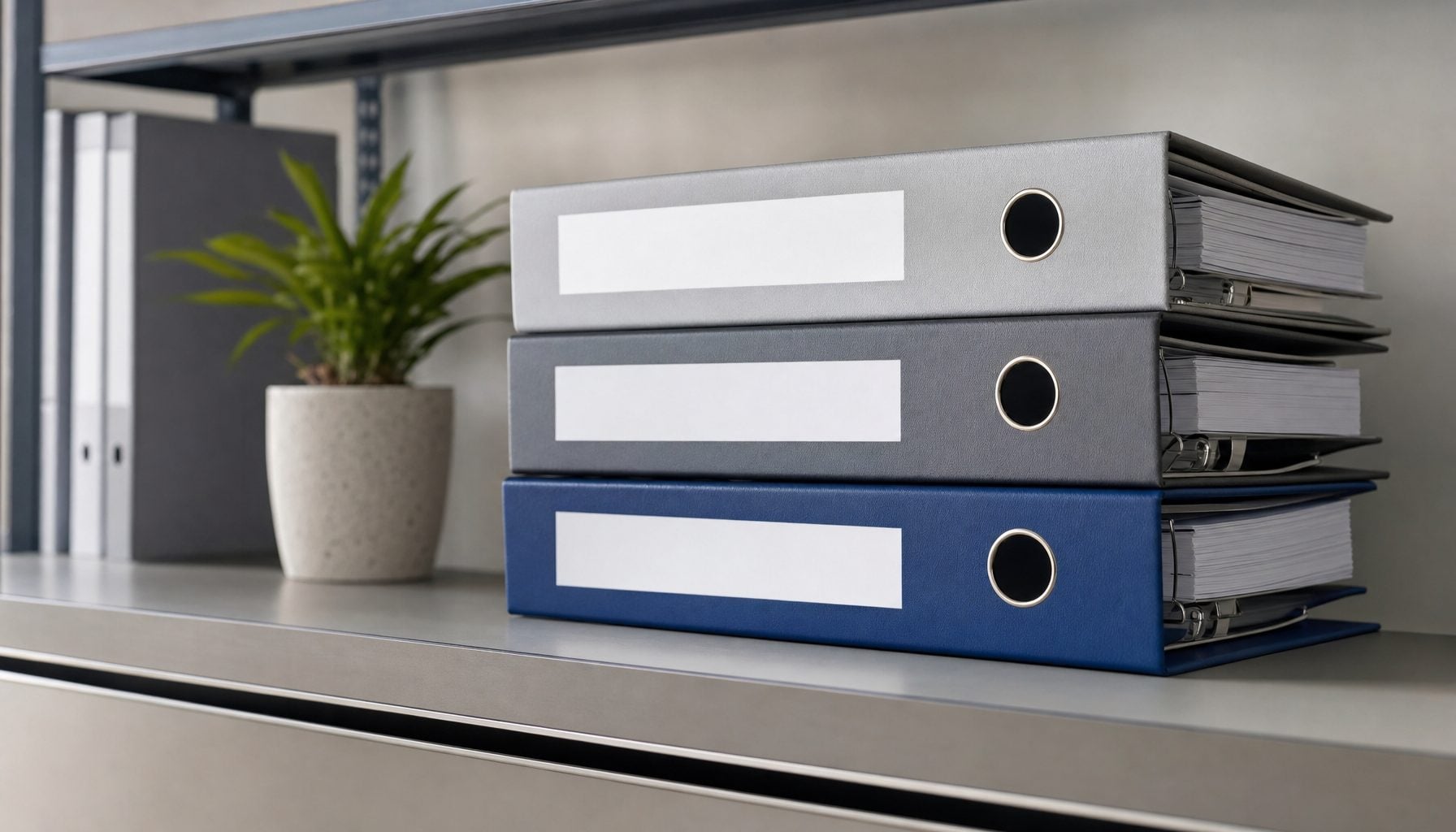 Stacked governance, risk and compliance binders on an office shelf
