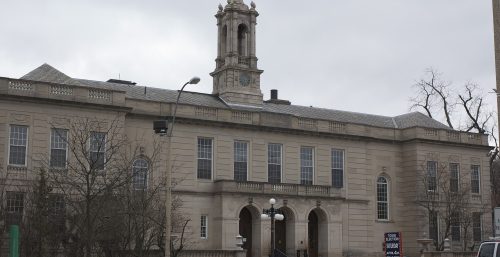 A managed building with a clock tower in Arlington.