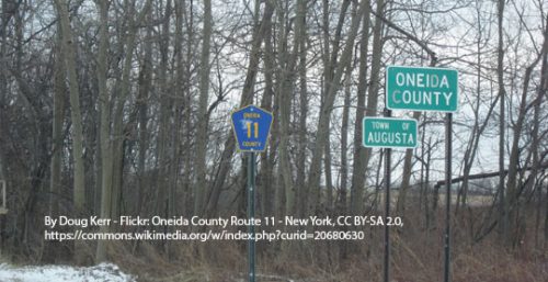 Road signs for Oneida County Route 11 and the Town of Augusta next to leafless trees in a rural area, highlighting the presence of managed IT services in Augusta.