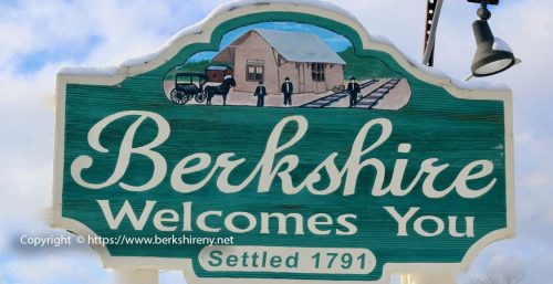 Sign reading "Berkshire Welcomes You, Settled 1791" with an illustration of a historical scene featuring a building, people, and a horse-drawn wagon. Embracing tradition while advancing into the future with managed IT services in Berkshire.