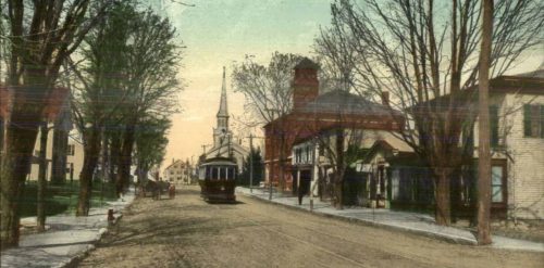 An old photo of a street with a trolley in Brookfield.