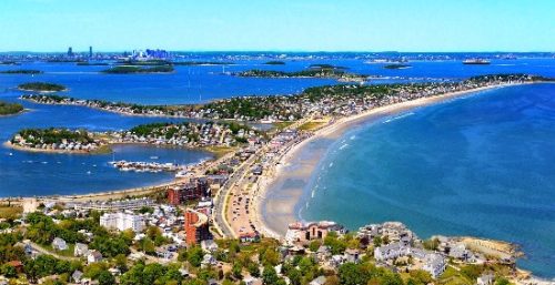 An aerial view of a beach and ocean, showcasing managed IT services in Hull.