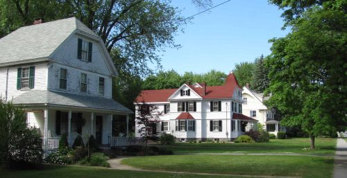 A neighborhood with a cluster of houses. A neighborhood with a cluster of houses.